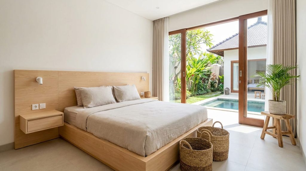 Simple touches using custom interior bedroom furniture in bali in a warm minimalist villa by Bali Interio